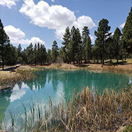 a blue lake in Torreon Golf Club