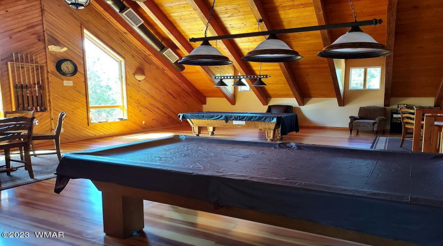 loft with pool tables in clubhouse