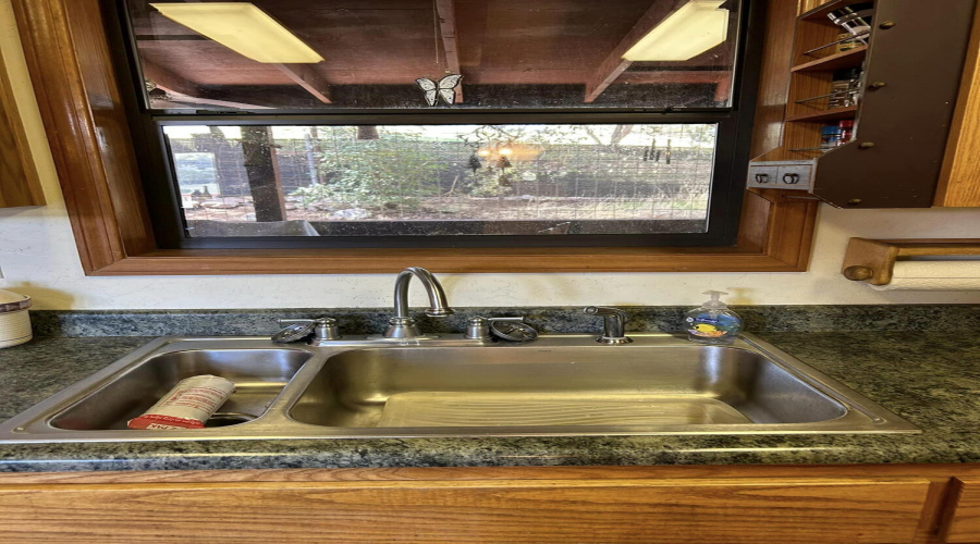 49 kitchen sink with windo looking out t