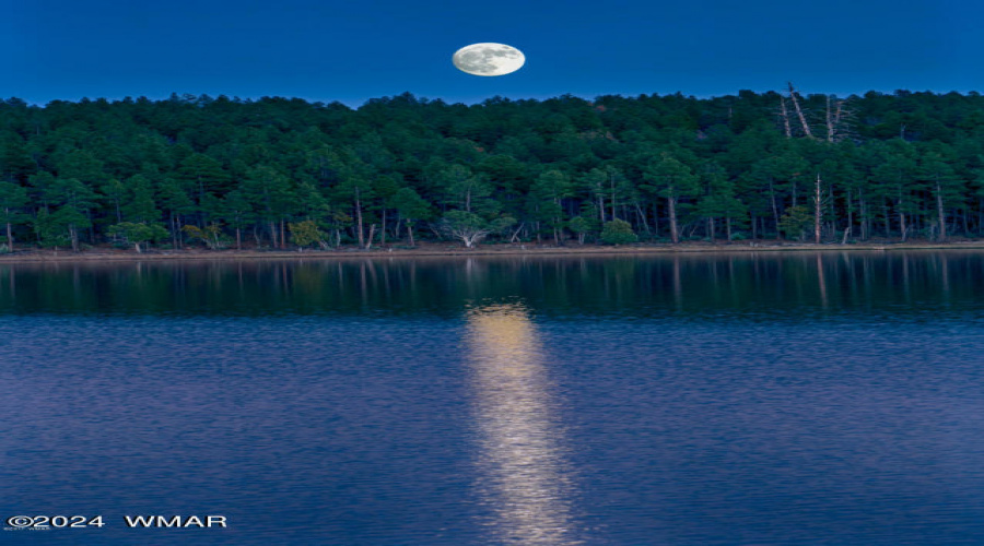 Beautiful full moon with lake reflection
