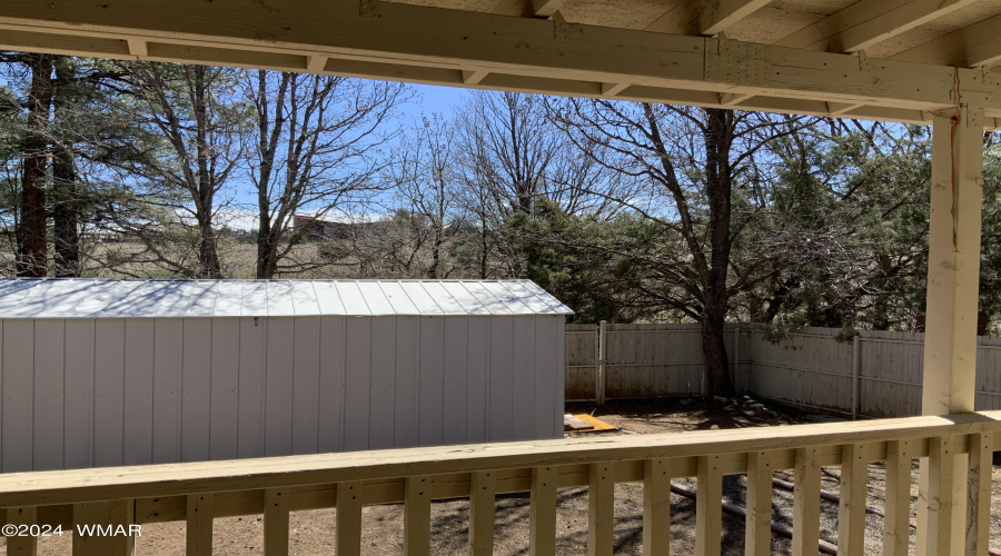 Back deck view of fenced yard