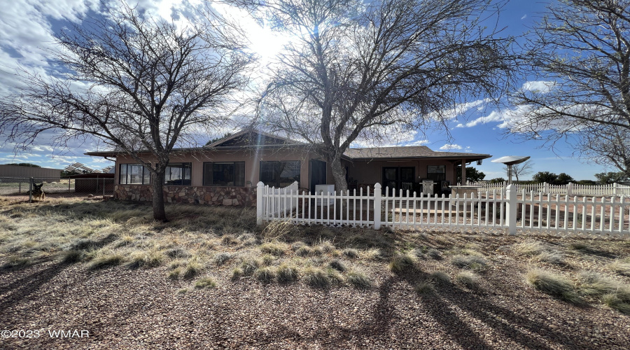 Separate fenced area in front of house.