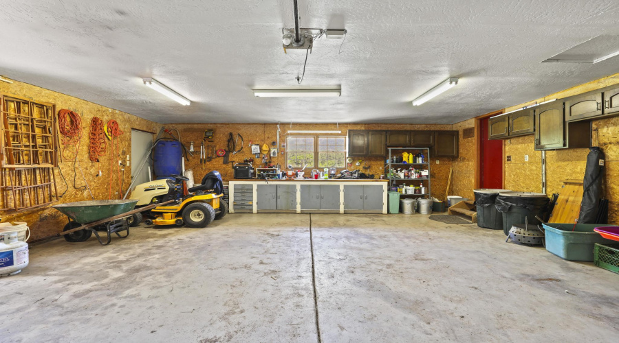 large 2 car garage and riding lawn mower