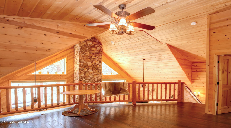 Loft with log railing