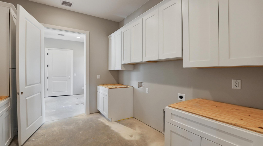 Laundry Area with Many Cabinets