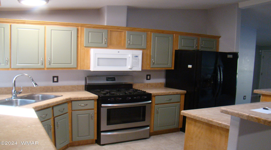 Kitchen stove, microwave and fridge