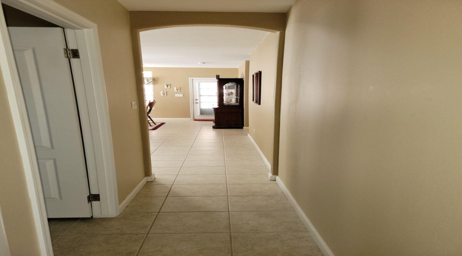 Entrance to laundry room on left