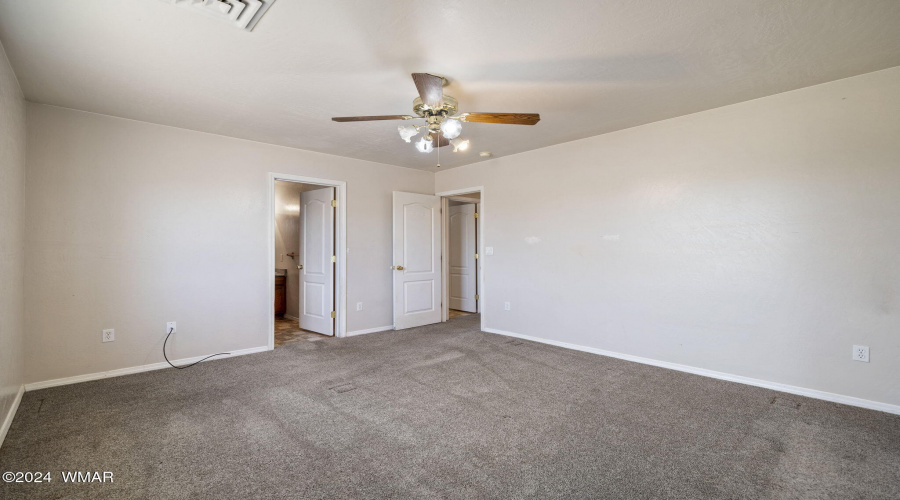 Primary bedroom facing bathroom