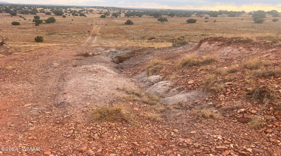 Rut in road at top of hill