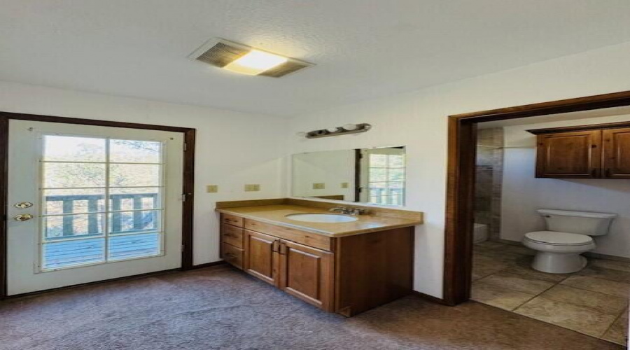 master bathroom with balcony exit