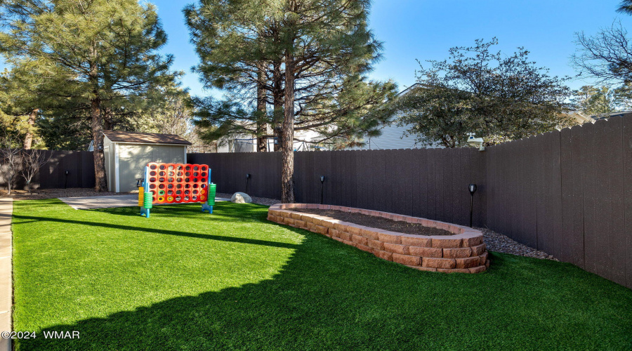 Shed, Raised Flower Bed & Grassy Area