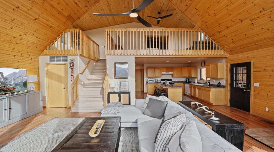 Living room with loft above