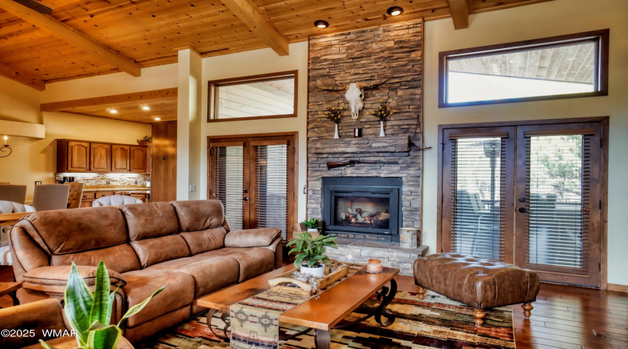 LR fireplace and kitchen view