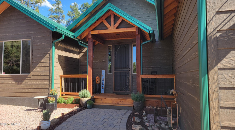 Welcoming front porch with recently adde