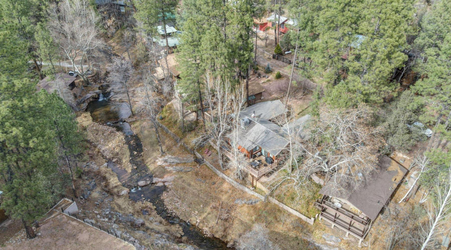 Aerial view of house near creek