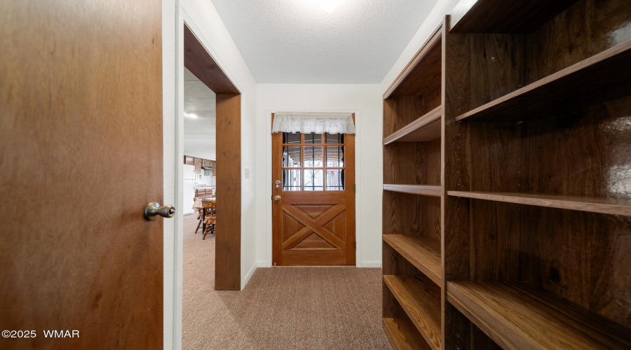 S hallway to master door to back deck