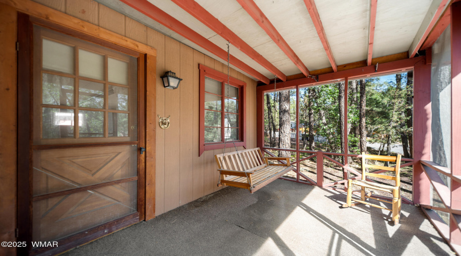 S screened in porch door to living room
