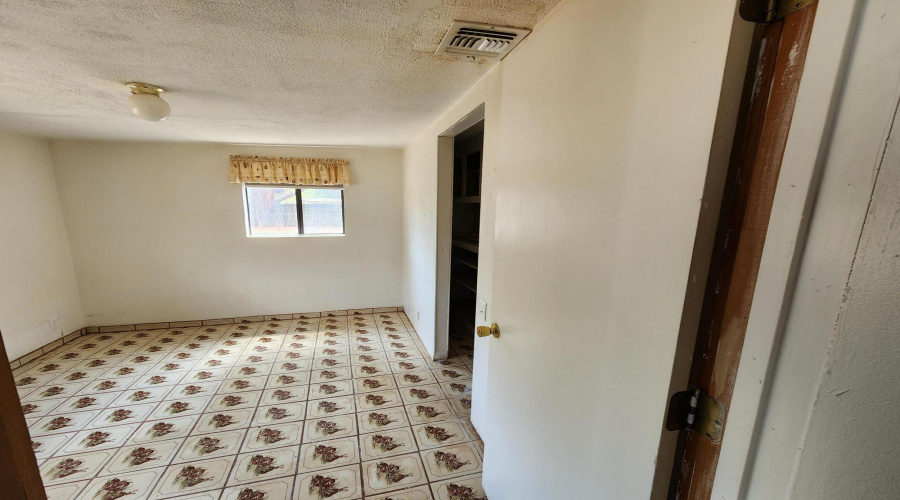 Bedroom off hallway to kitchen