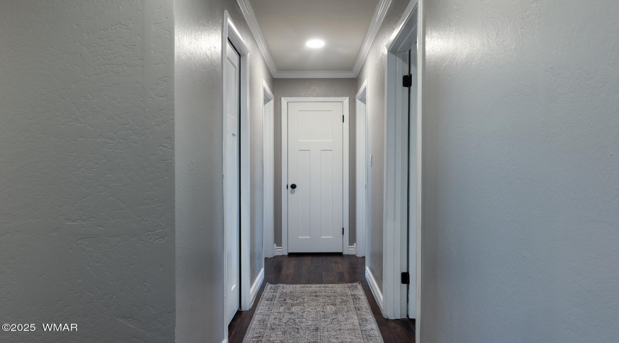 Hallway to 3 bedrooms and 2 bathrooms