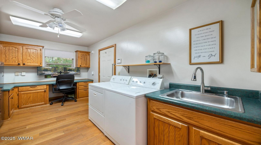 Laundry room with office space