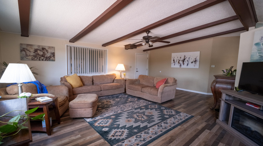 Spacious living room with wood beams
