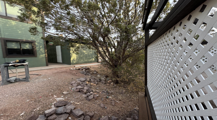 View of garage and shed from spa