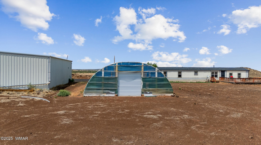 GARAGE, GREEN HOUSE, AND RESIDENCE