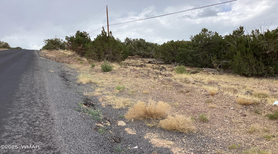 County maintained chip sealed road to th
