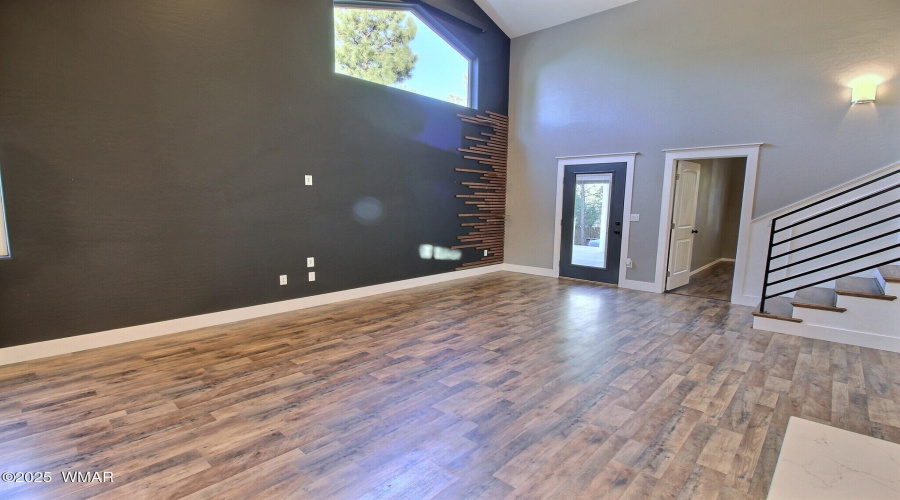 Great room leads to Primary Bedroom