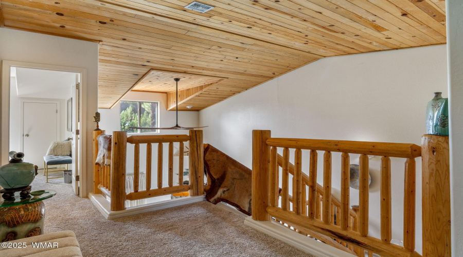 Upstairs landing with log accents