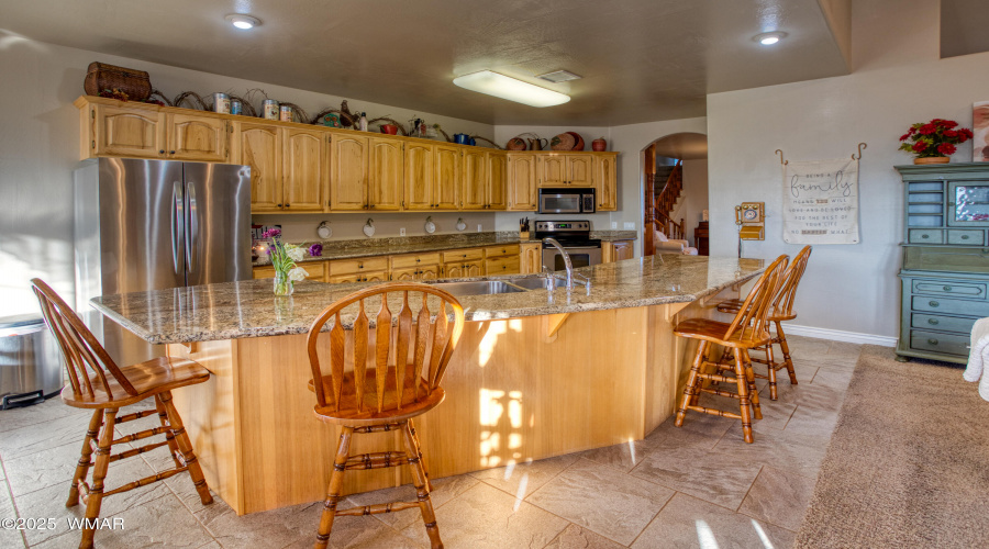Huge Island Opens to Living Room